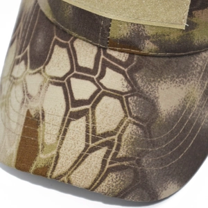 Detail of python camouflage tactical cap with front velcro patch and reinforced brim stitching