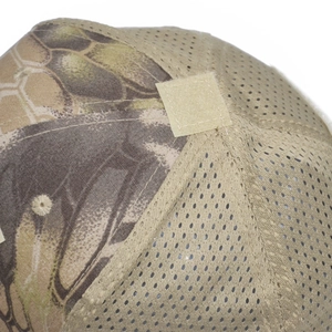 Close-up of camouflage tactical mesh cap featuring breathable fabric and top velcro patch