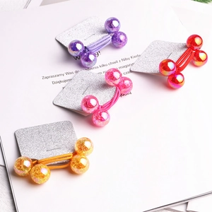 Set of 4 elastic hair ties with shimmering glitter beads in purple, red, pink, and yellow