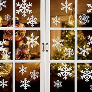 White Christmas snowflake static window stickers displayed on a glass shop door background