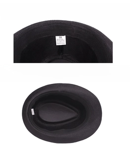 Detailed interior of black straw hat showing 58cm size label and sweatband quality