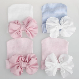 Soft newborn baby knit hats with large chiffon bows in a four-piece multi-color set