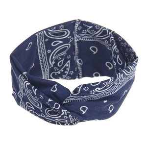 Detail of navy blue bohemian headband with white paisley print and twist knot design