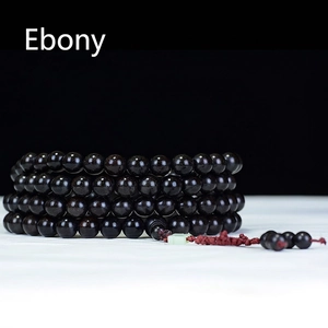 Minimalist Ebony wood 108 beads mala bracelet with red knot and elegant dark background