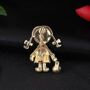 Back view of cute girl brooch in gold finish with vertical safety pin and round charm