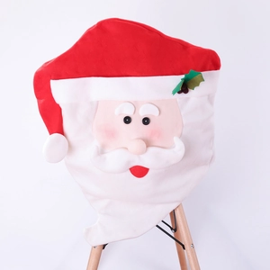Close-up of Santa Claus chair cover on a wooden seat for Christmas dining decor