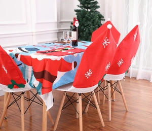 Christmas home decor set featuring red snowflake chair covers and a festive tablecloth