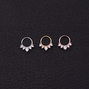 Tribal septum clicker rings in gold, silver, and rose gold with zircon stones