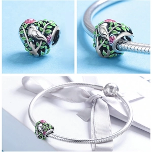S925 sterling silver heart charm with bird and enamel floral details on bracelet