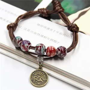 Handmade woven leather zodiac bracelet with ceramic beads and bronze Virgo pendant
