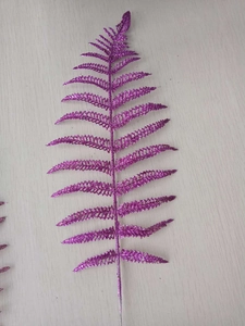 Detail of purple glitter artificial fern leaf for Christmas tree decoration