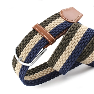 Elastic woven belt with brown leather trim and silver buckle on white background