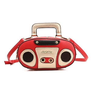 Detail of red radio-shaped crossbody bag with gold handles and Jingpin logo