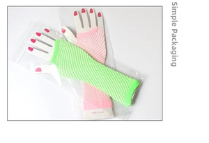 Detail view of long neon green and pink fishnet fingerless gloves in simple packaging