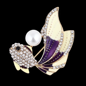 Elegant gold fish brooch with gradient enamel tail and pearl accent on black background