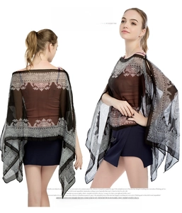 Detail view of women's chiffon sun shawl featuring bohemian paisley print in black and white