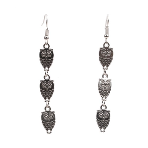 Antique silver triple owl drop earrings with detailed metalwork on a white background