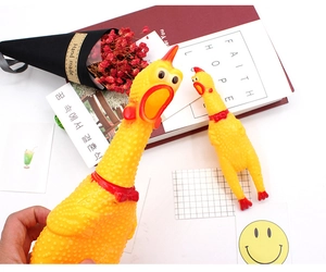 Close-up of small and large screaming chicken toys made of durable yellow rubber
