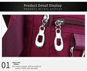 Detailed close-up of premium metal dual zippers on a purple nylon crossbody shoulder bag