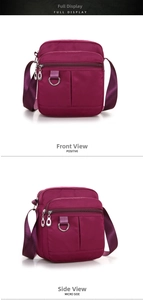 Detail view of purple waterproof nylon crossbody bag with multiple zipper compartments