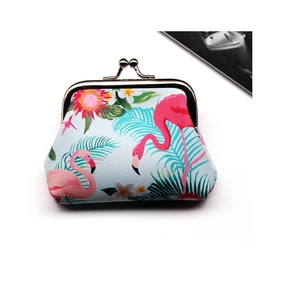 Close-up of tropical flamingo and palm leaf print coin purse with vintage metal clasp