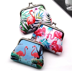 Three flamingo print coin purses with vintage metal clasps on a white background