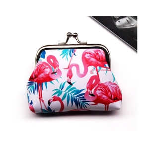 Detail of pink flamingo print coin purse with vintage metal clasp on canvas material