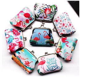 Flat lay of eight flamingo print clasp coin purses with retro metal frames in various patterns