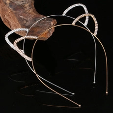 Detail of cat ear headbands in silver and rose gold with sparkling rhinestone finish