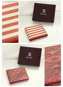 Close-up of red striped and black snake skin wallets with premium crocodile texture gift box