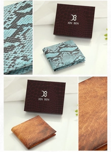 Close-up of vintage snake and crocodile pattern men wallets in elegant gift boxes
