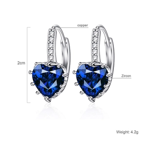 Detailed view of silver heart earrings with blue cubic zirconia and dimensions
