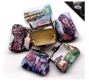 Macro detail of six retro vintage scenery coin purses with metal clasps and interior lining