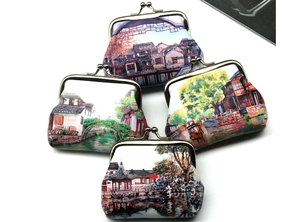 Detail of vintage landscape print mini wallets with classic metal kiss-lock closure set