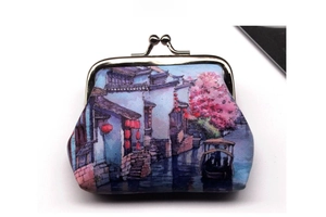 Close-up of retro kiss-lock coin purse with vintage Chinese town landscape print