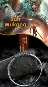 Detailed macro of vintage silver Sun Wukong staff bangle with cloud relief and dragon scales