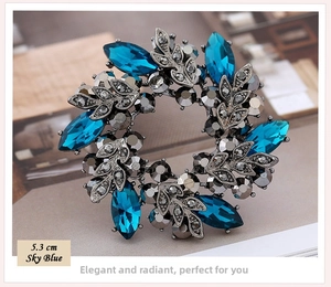 Close-up of 5.3cm blue crystal bauhinia flower brooch with vintage silver alloy base