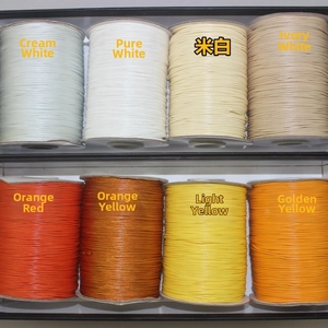 Macro detail of eight colorful wax cord rolls for DIY jewelry and manual weaving