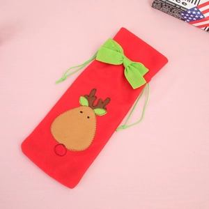 Detail of red Christmas wine bag featuring a reindeer applique and green bow