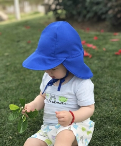 Detail of royal blue baby sun hat with long brim and neck protection flap for outdoor use