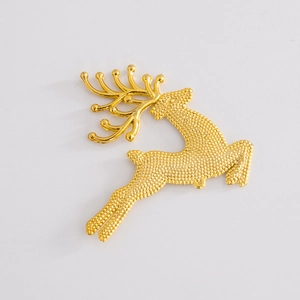 Detailed view of a golden metal reindeer pendant with textured surface for DIY jewelry