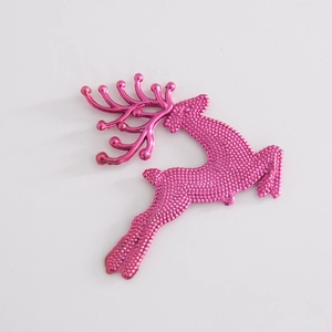 Metallic rose red reindeer ornament with textured dot finish and smooth antlers on white