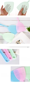 Detail of durable manual fly swatters in pastel colors with flexible mesh and hanging hole