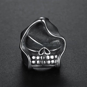 Detailed view of punk style skull ring with vintage silver finish and intricate tooth details
