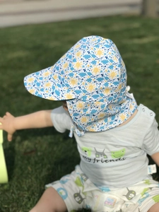 Detail of kids sun hat featuring breathable fabric and protective neck flap design