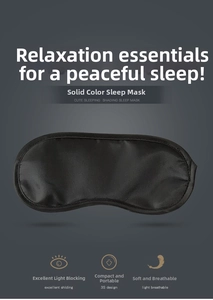 Close-up of smooth black satin sleep mask with high-quality edge stitching for blocking light