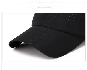 Close-up of the curved brim on a black breathable mesh sport baseball cap for sun protection