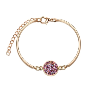 Detail of rose gold bangle with purple crystal cluster inlay and adjustable lobster clasp