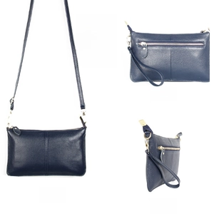 Three views of a sapphire blue leather crossbody envelope bag with gold hardware
