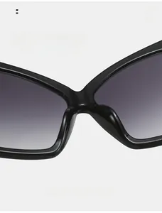Detail of comfortable integrated nose pads on black oversized bow-shaped sunglasses